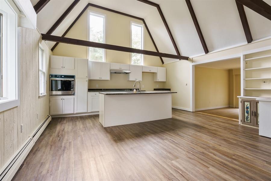 75 John Thomas Road Eastham, MA 02642 - Photo 7 of 23 a view of a kitchen with a sink wooden floor and a window