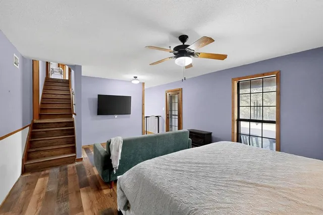 a bedroom with furniture and baby crib