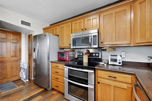 a outdoor living space with furniture and a fireplace