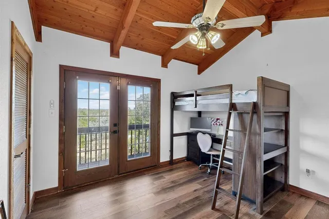 a wooden bench sitting in the middle of a forest
