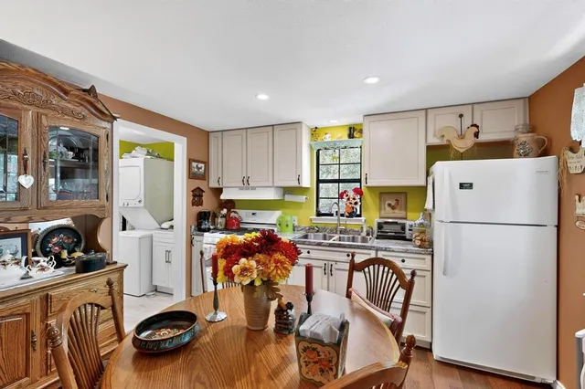 a dining room with furniture and wooden floor