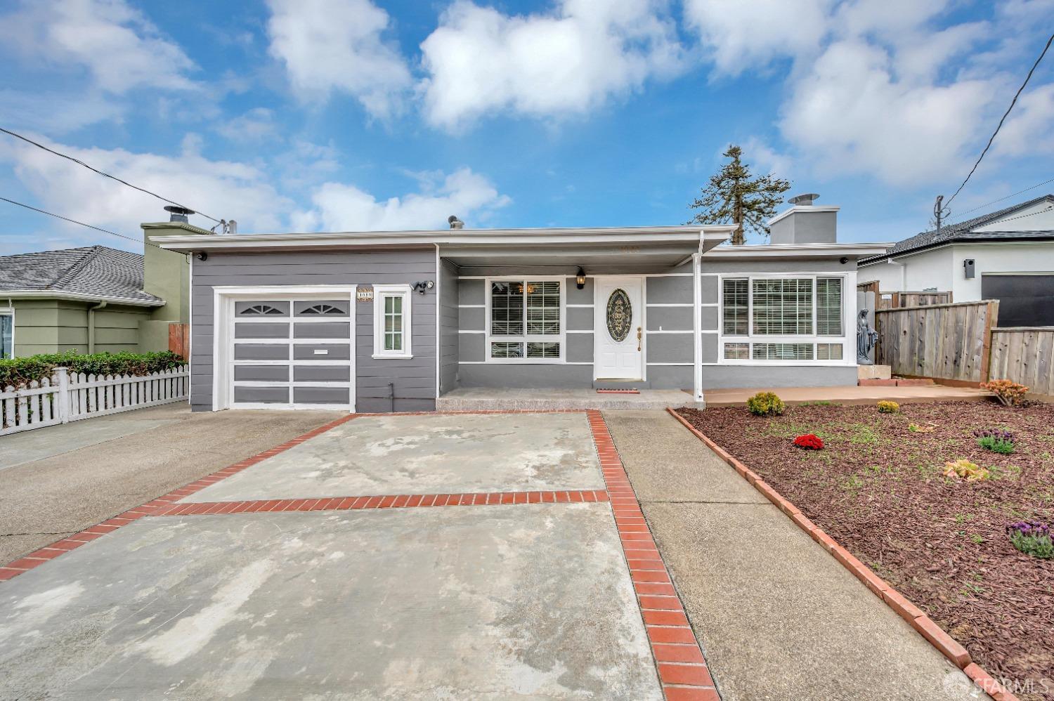 1023 Gilman Drive Daly City, CA 94015 - Photo 1 of 1 a front view of a house with a garage