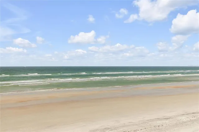 a kitchen with a stove and a refrigerator