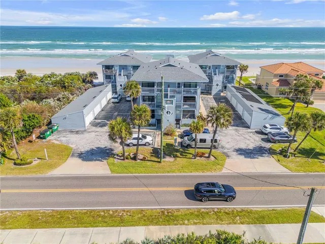 a dining room with furniture a chandelier and window