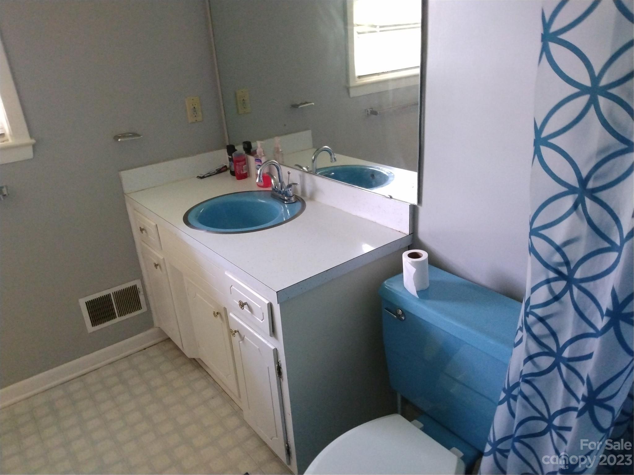 336 Mt Tabor Church Road Union, SC 29379 - Photo 19 of 37 a bathroom with a sink toilet and a mirror
