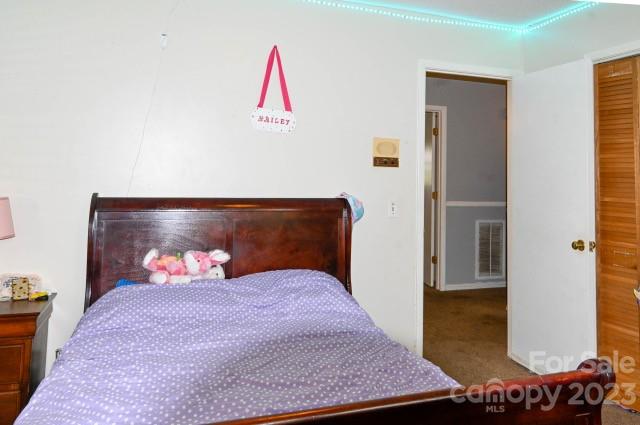 336 Mt Tabor Church Road Union, SC 29379 - Photo 20 of 37 a bedroom with a bed and a potted plant