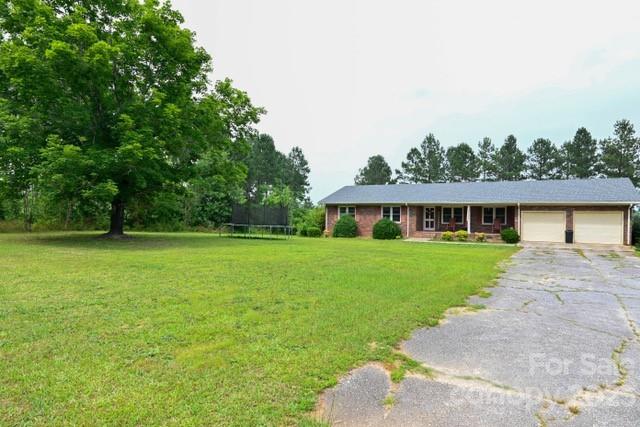336 Mt Tabor Church Road Union, SC 29379 - Photo 2 of 37 a front view of a house with garden