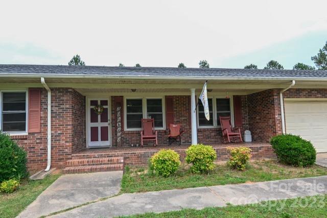 336 Mt Tabor Church Road Union, SC 29379 - Photo 4 of 37 a front view of a house with garden and porch
