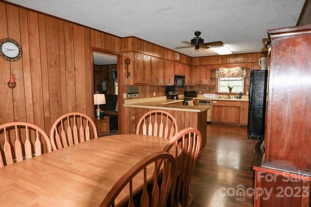 336 Mt Tabor Church Road Union, SC 29379 - Photo 7 of 37 a kitchen with sink refrigerator dining table and chairs