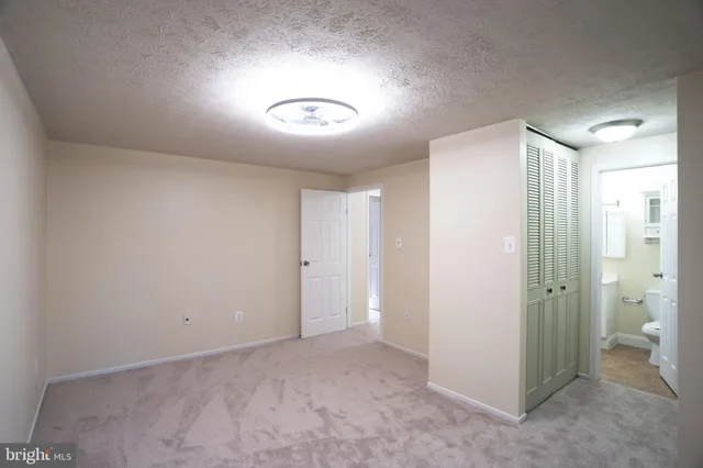 a view of a hallway with a livingroom