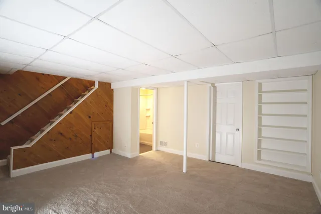 a view of an empty room with a windows