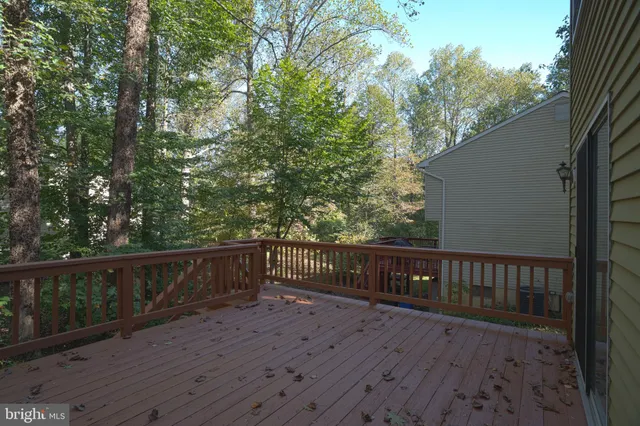 a view of deck with wooden floor and outdoor seating