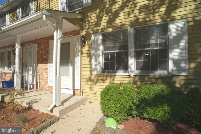 a view of a brick house with a large windows