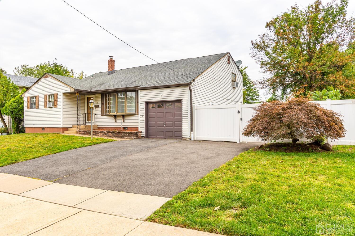 41 Partch Place Edison, NJ 08817 - Photo 1 of 28 a house with a yard and garage