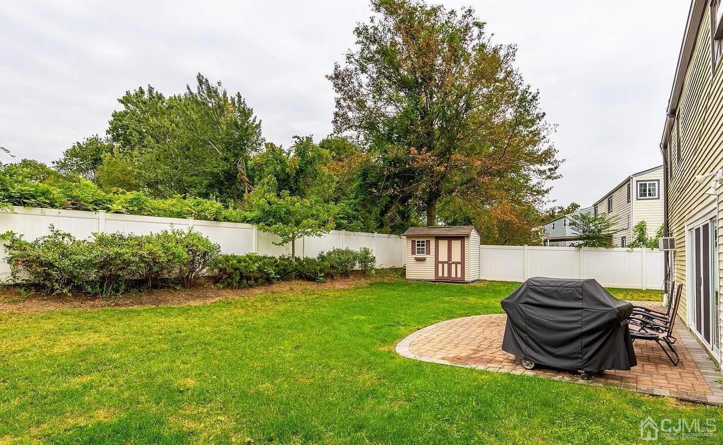 41 Partch Place Edison, NJ 08817 - Photo 26 of 28 a view of a backyard with a garden and plants