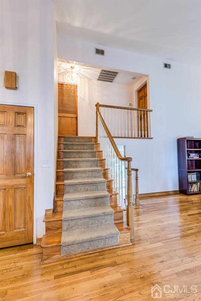 41 Partch Place Edison, NJ 08817 - Photo 10 of 28 a view of entryway and hall with wooden floor