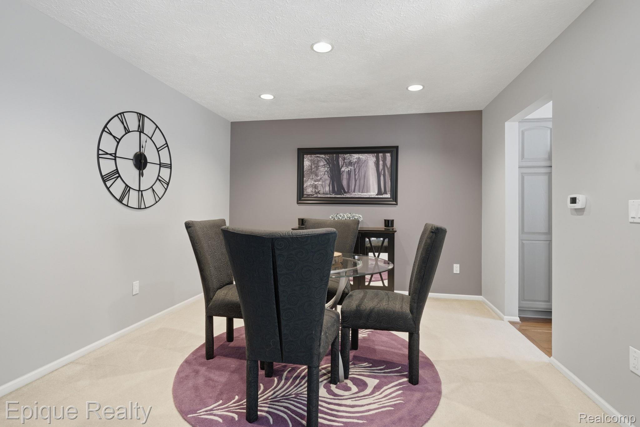 6607 Ridgeview Drive Clarkston, MI 48346 - Photo 11 of 25 Dining area with light carpet, recessed lighting, and a textured ceiling