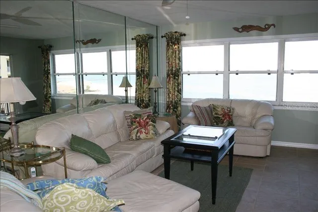 a large bedroom with a bed and window