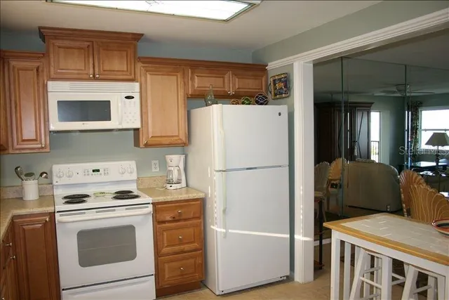 a view of room with furniture and wooden floor