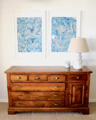 a bedroom with a bed and a chair