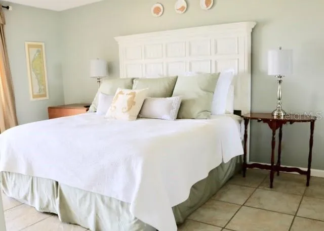 a bathroom with a bathtub and a double vanity sink mirror