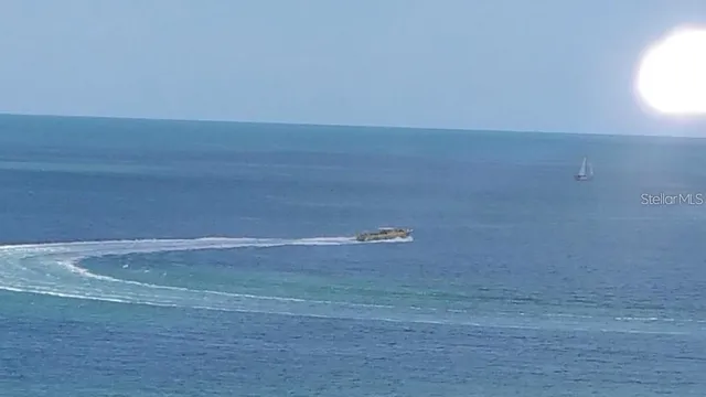 a dining room with furniture a rug and wooden floor
