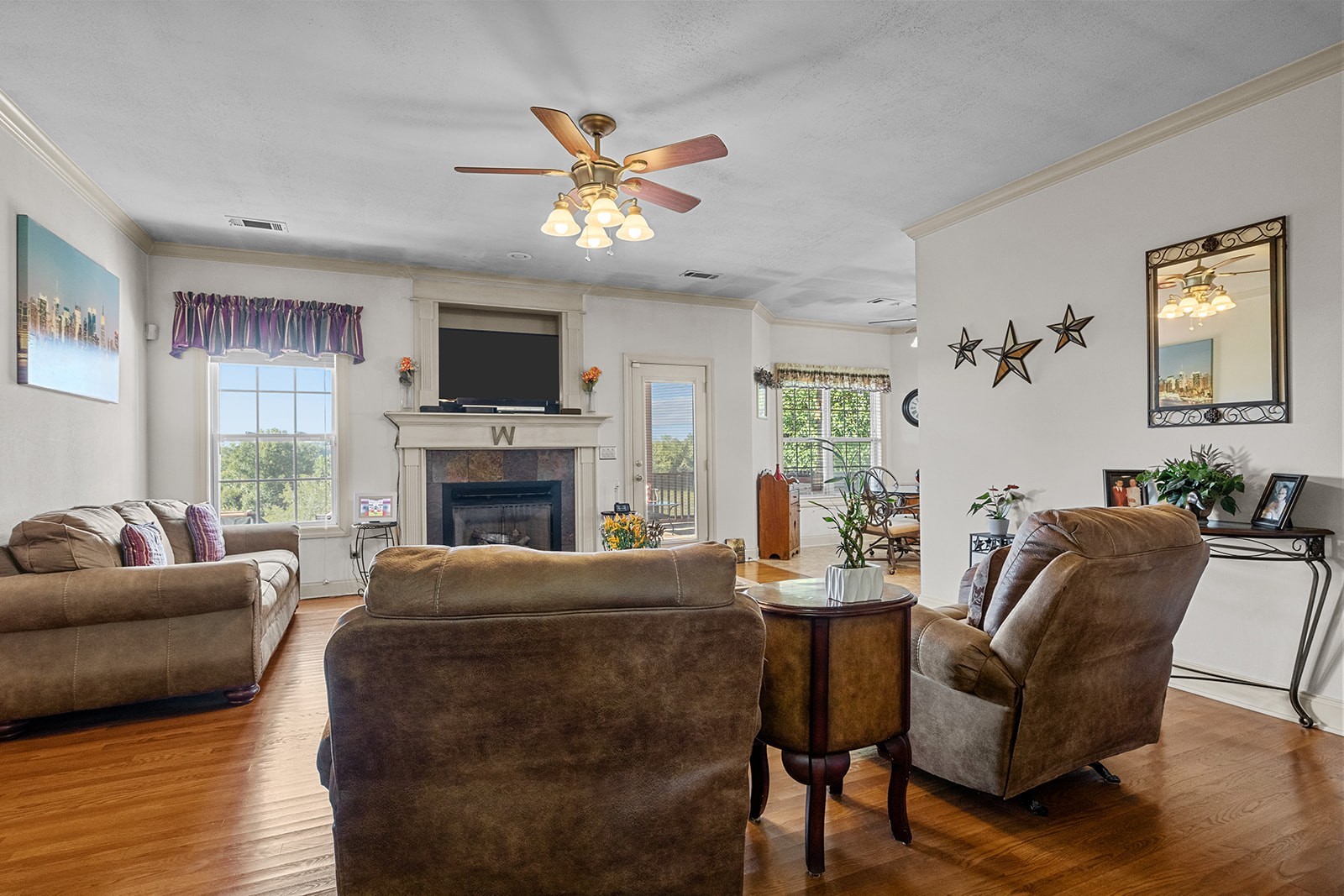 341 Murrell Road Dickson, TN 37055 - Photo 8 of 14 a living room with furniture a fireplace and a flat screen tv