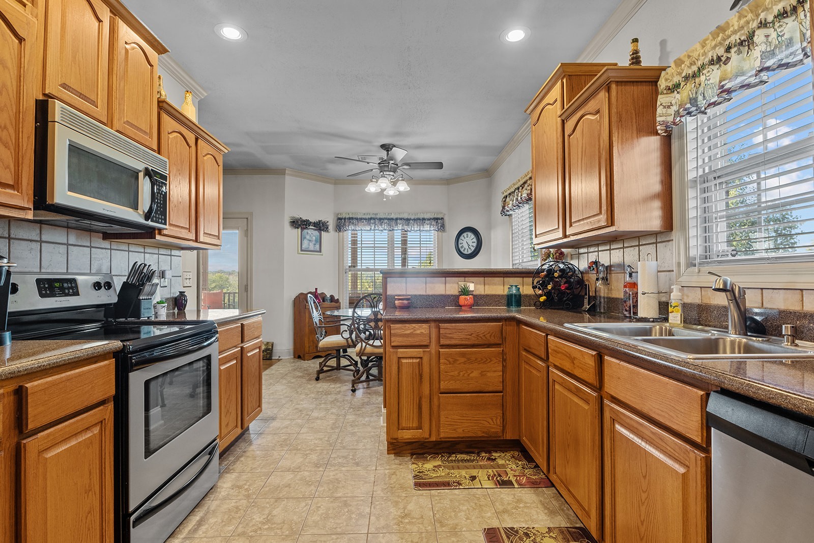 341 Murrell Road Dickson, TN 37055 - Photo 9 of 14 a kitchen with stainless steel appliances a stove sink and cabinets