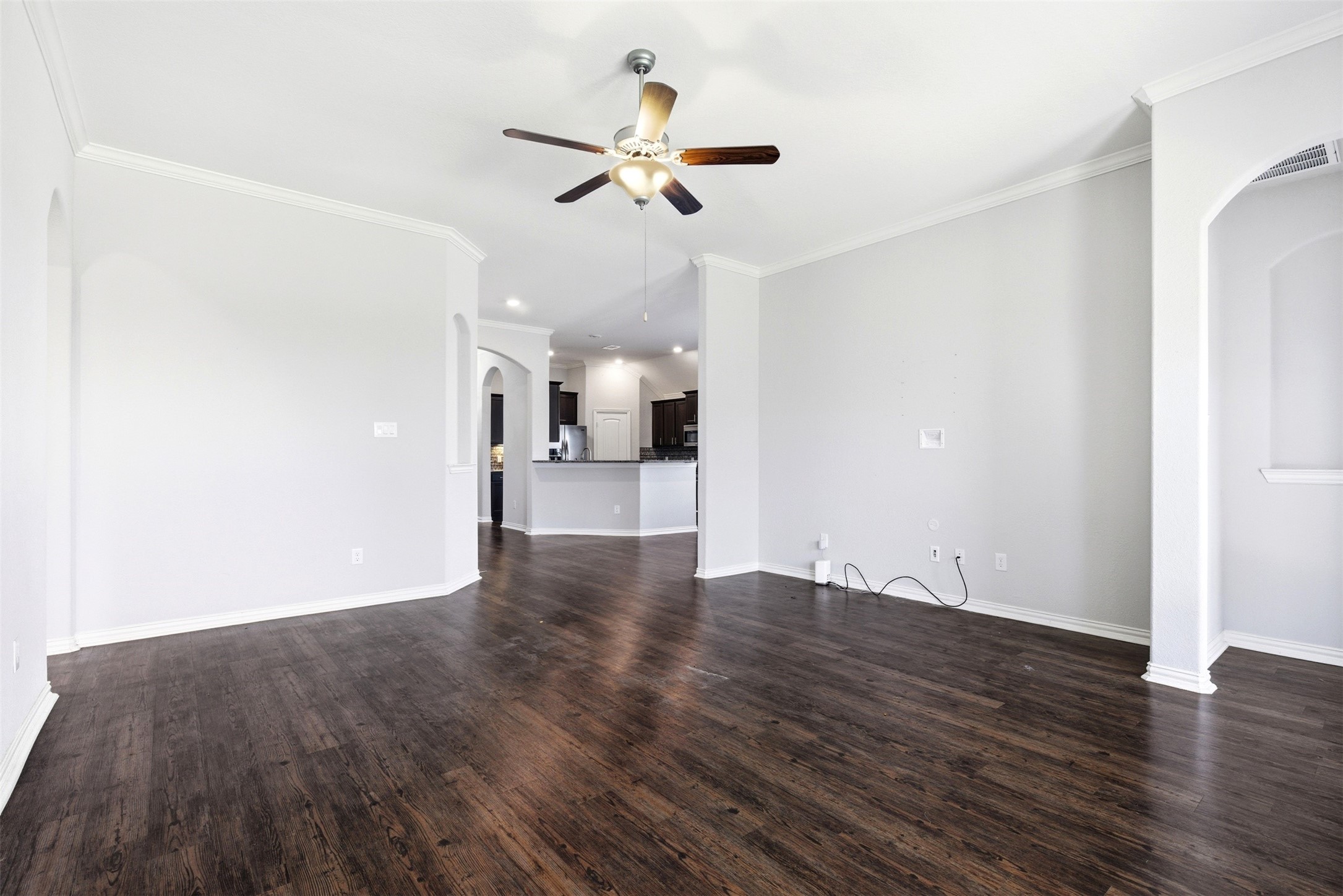 4507 Barnstone Ridge Lane Rosharon, TX 77583 - Photo 11 of 23 a view of a livingroom with wooden floor and a ceiling fan