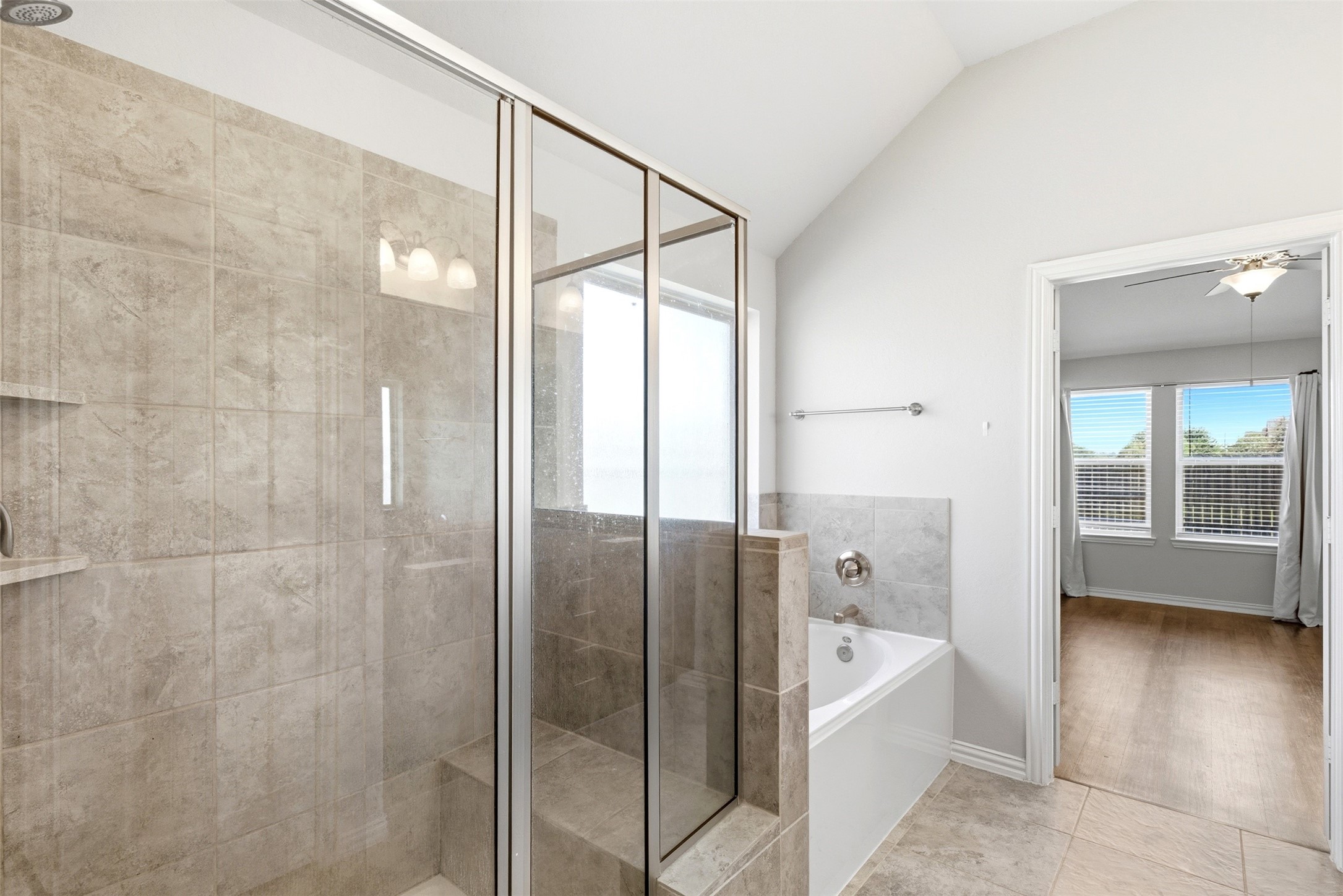 4507 Barnstone Ridge Lane Rosharon, TX 77583 - Photo 15 of 23 a bathroom with a bathtub and a shower