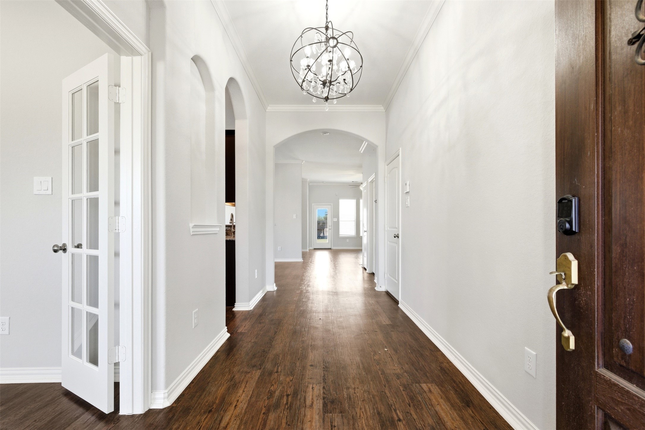 4507 Barnstone Ridge Lane Rosharon, TX 77583 - Photo 3 of 23 a view of a hallway with wooden floor and staircase