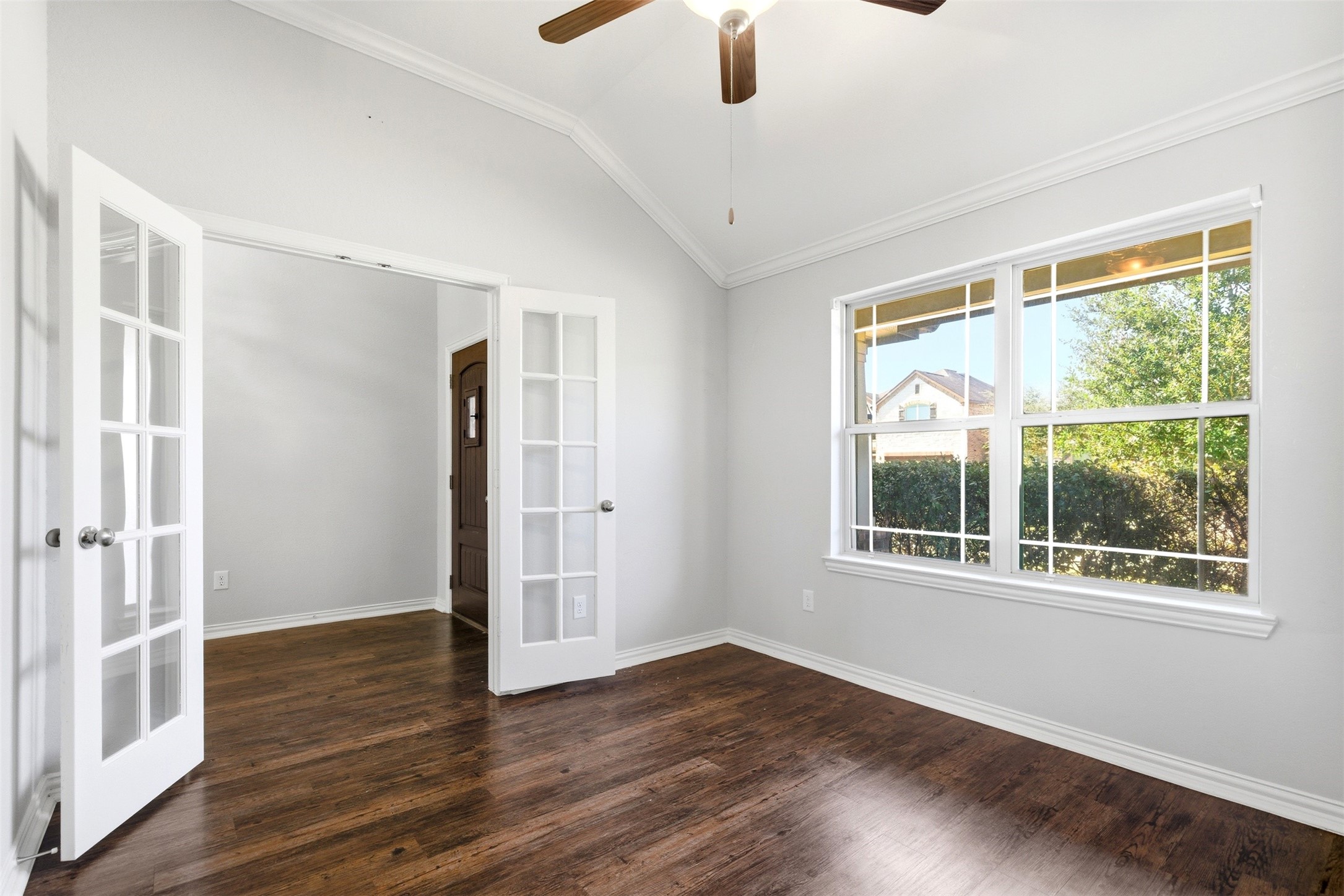 4507 Barnstone Ridge Lane Rosharon, TX 77583 - Photo 5 of 23 a view of an empty room with wooden floor and a window