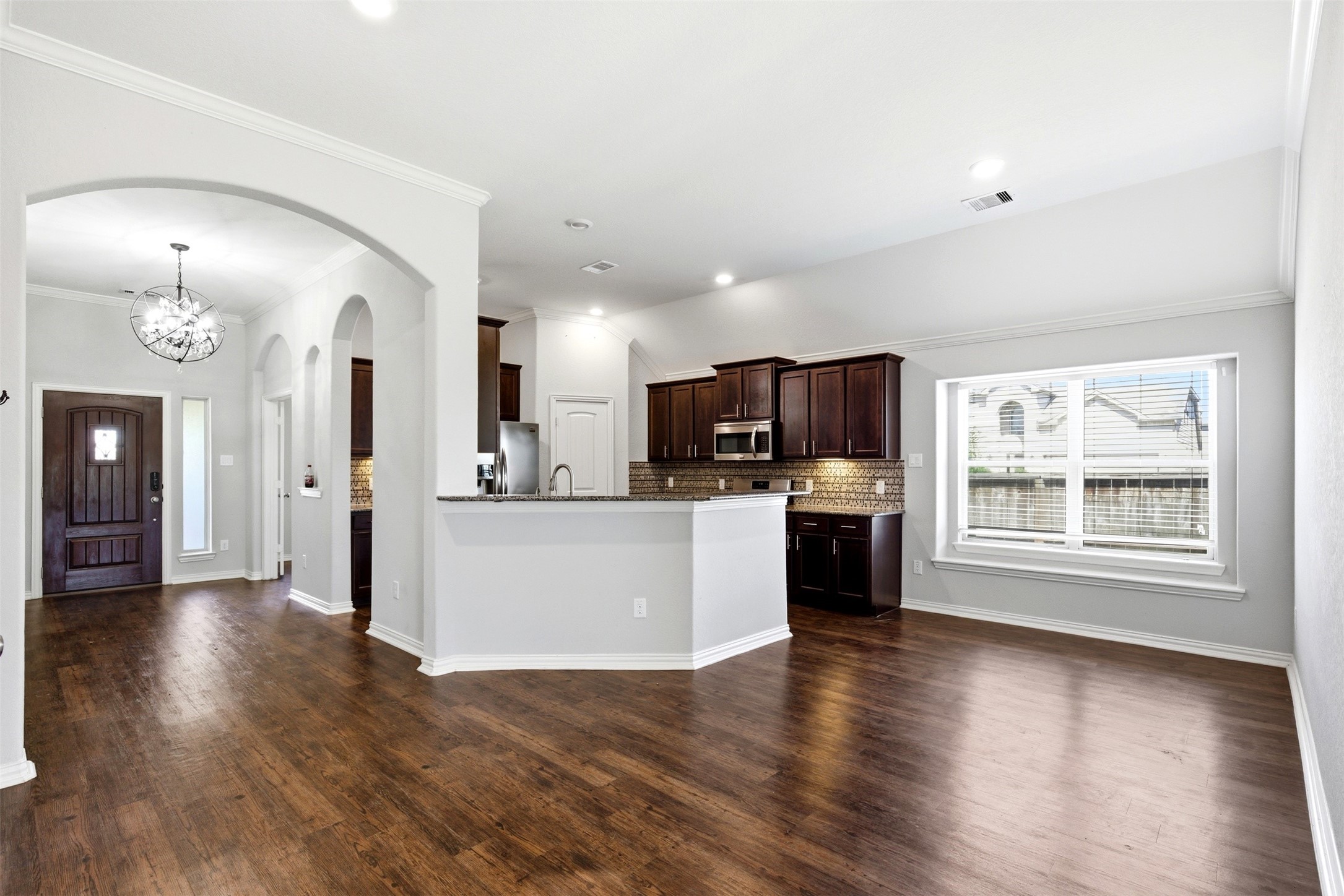 4507 Barnstone Ridge Lane Rosharon, TX 77583 - Photo 9 of 23 a view of a kitchen with furniture and wooden floor