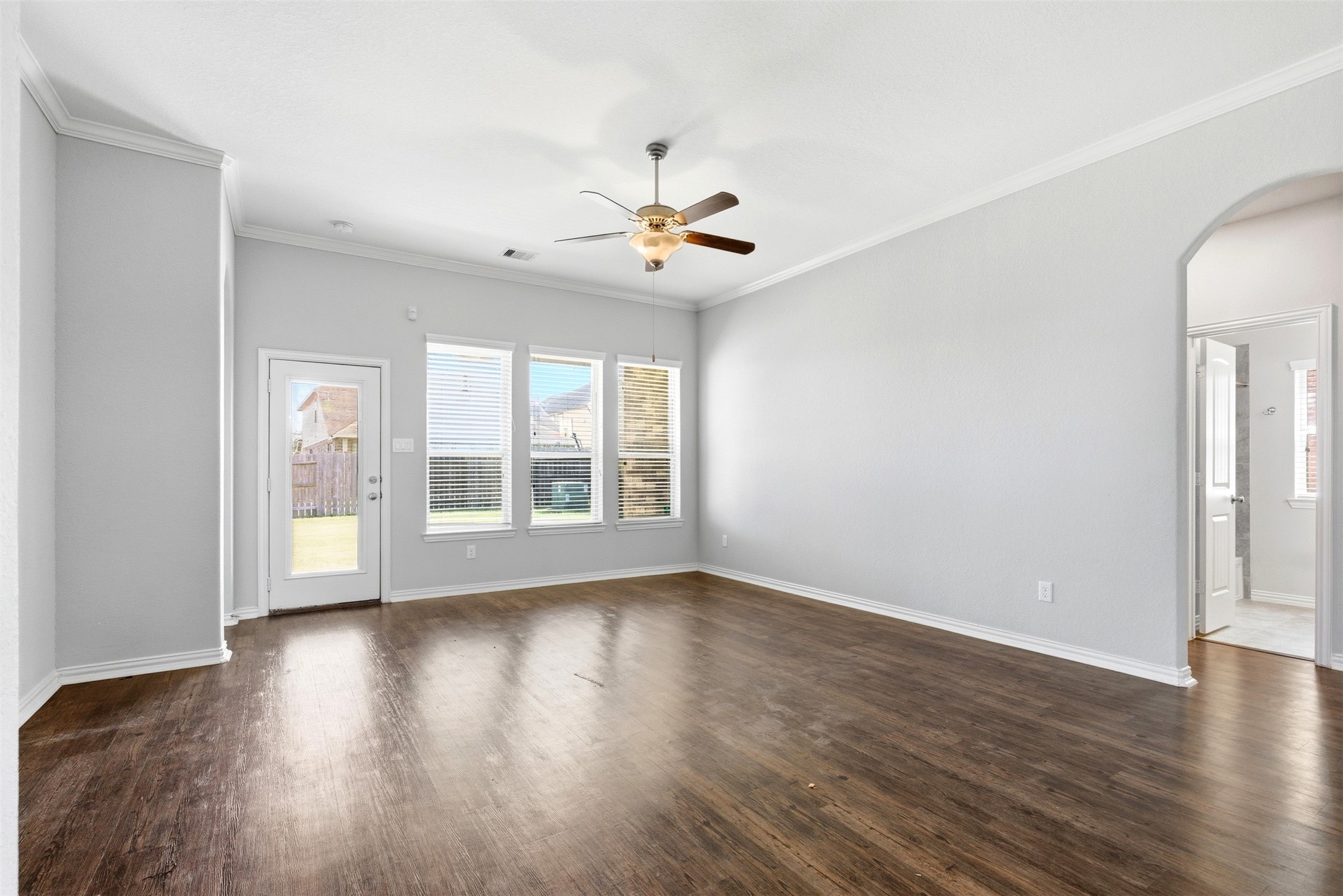 4507 Barnstone Ridge Lane Rosharon, TX 77583 - Photo 10 of 23 a view of an empty room with wooden floor and a window