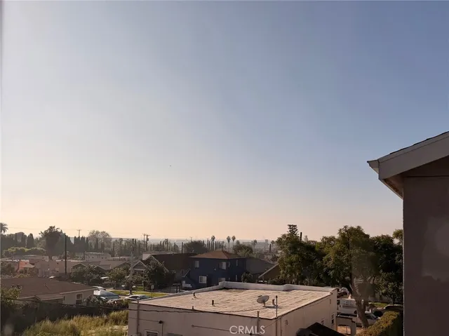 a view of a terrace with a forest
