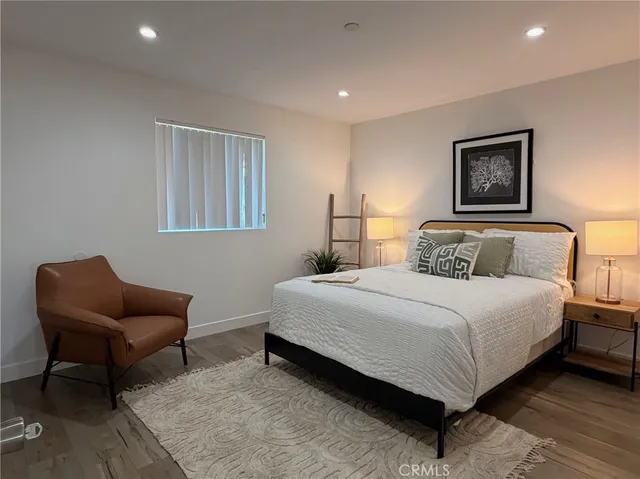 a bedroom with bed and furniture