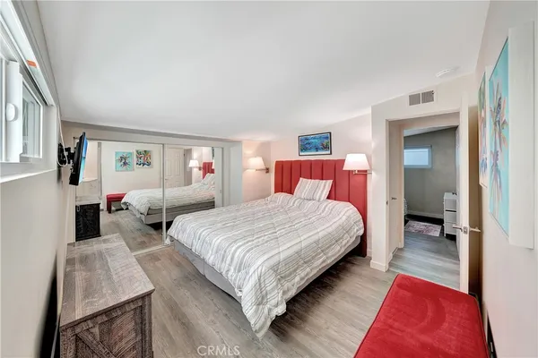 a bedroom with bed and window