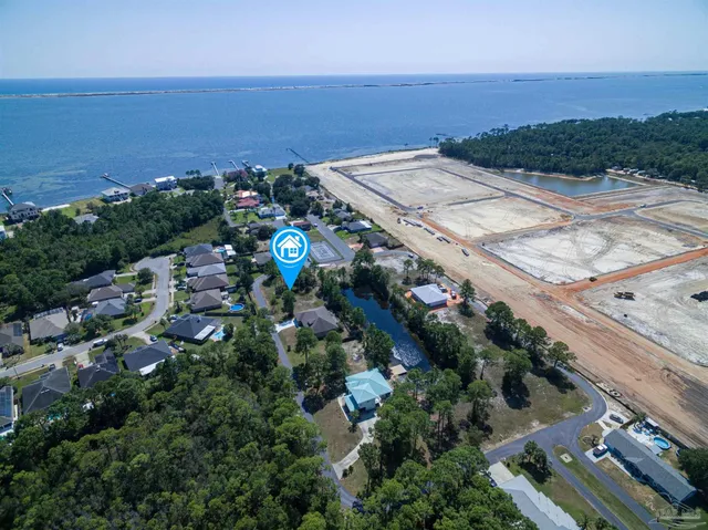 a front view of house with yard and trees