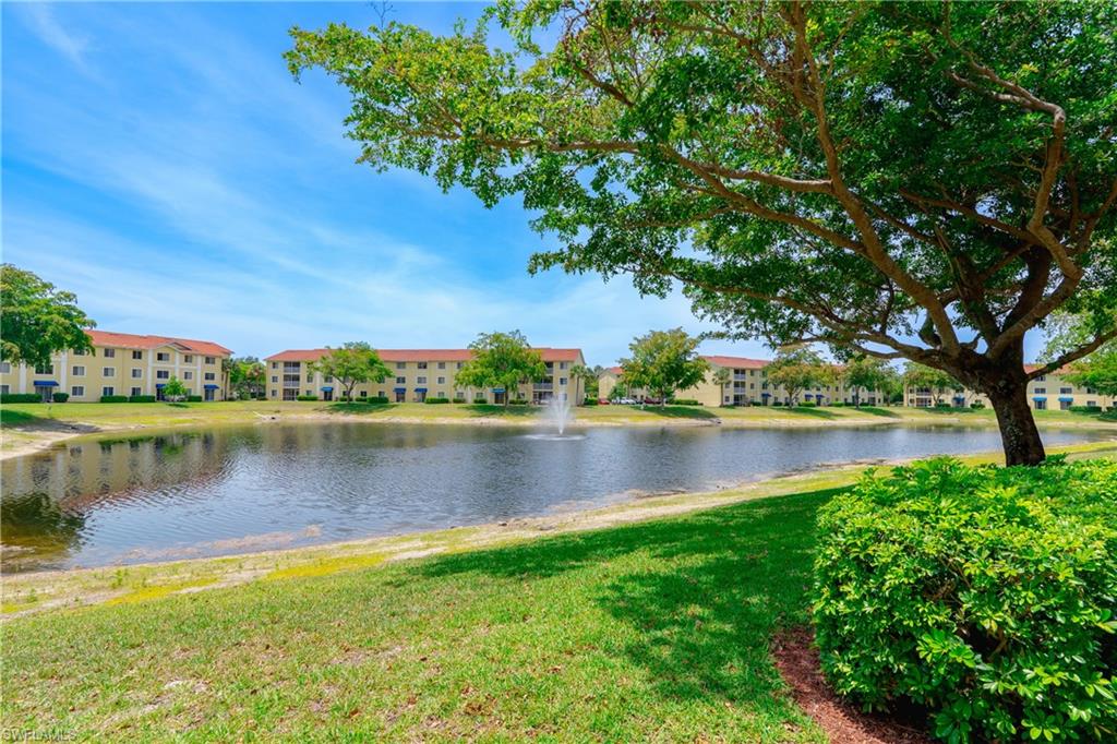 8264 Key Royal Circle, Unit 813 Naples, FL 34119 - Photo 1 of 21 a view of a lake with a lake view