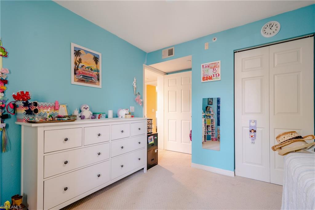 8264 Key Royal Circle, Unit 813 Naples, FL 34119 - Photo 18 of 21 a room with toys and window