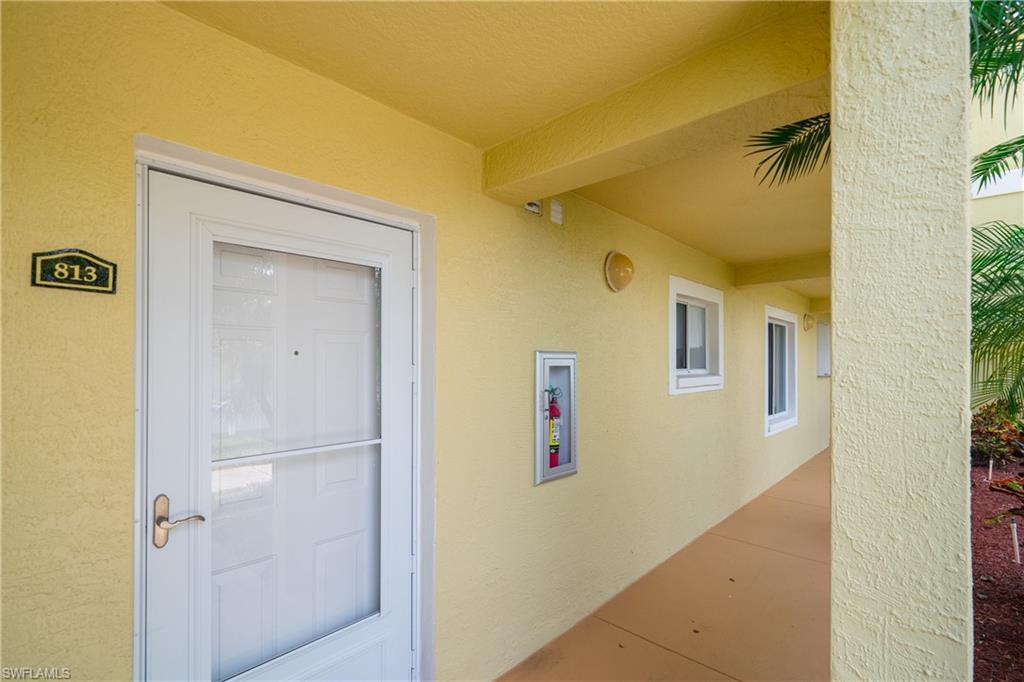 8264 Key Royal Circle, Unit 813 Naples, FL 34119 - Photo 3 of 21 a view of a hallway with closet