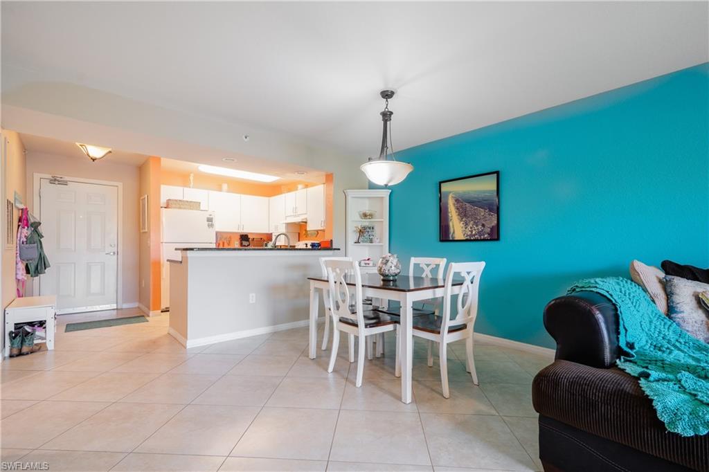 8264 Key Royal Circle, Unit 813 Naples, FL 34119 - Photo 7 of 21 a view of a dining room with furniture window and outside view