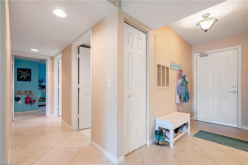 8264 Key Royal Circle, Unit 813 Naples, FL 34119 - Photo 10 of 21 a living room with furniture and a window
