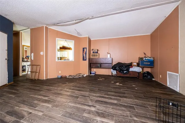 a view of a livingroom with furniture water view and a large window