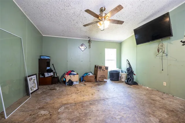a bathroom with a granite countertop sink mirror and a bathtub