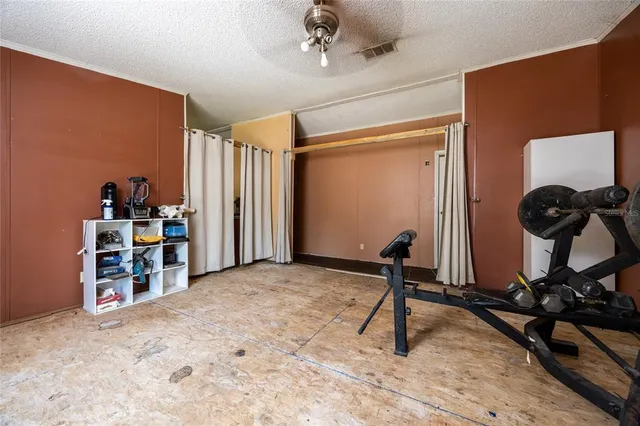 a bedroom with a bed and a mirror