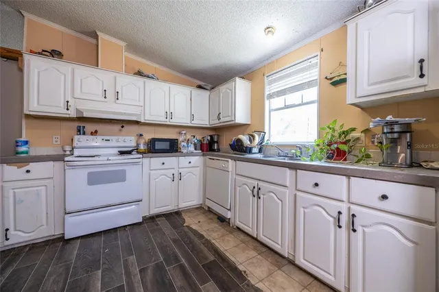 a view of a livingroom with furniture and wooden floor