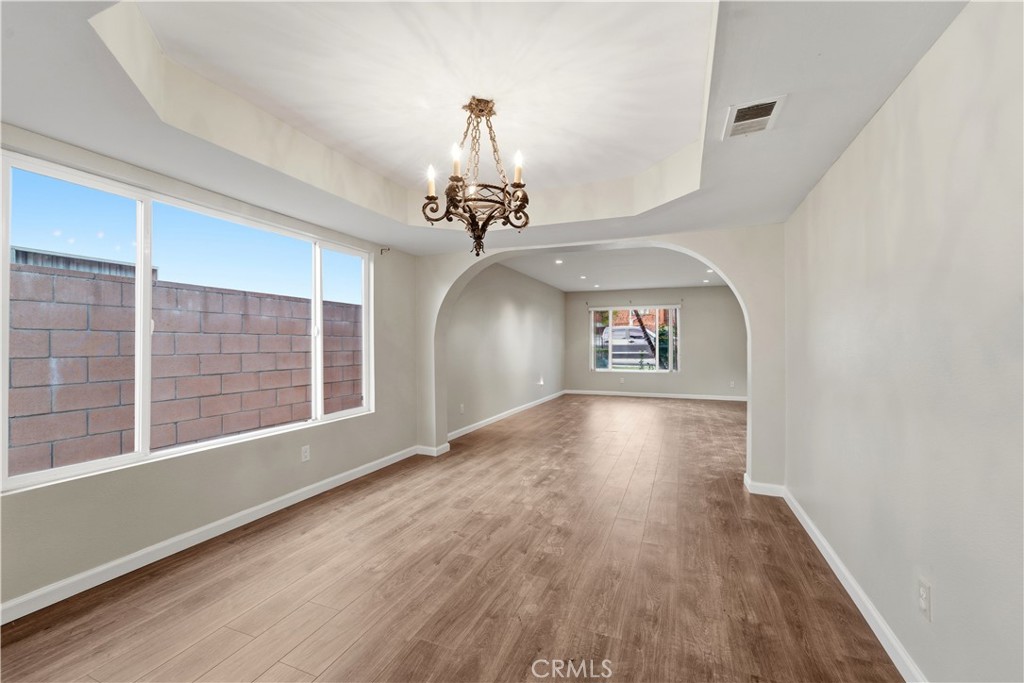 16650 Rinaldi Street Granada Hills, CA 91344 - Photo 11 of 35 a view of a livingroom with wooden floor and a ceiling fan