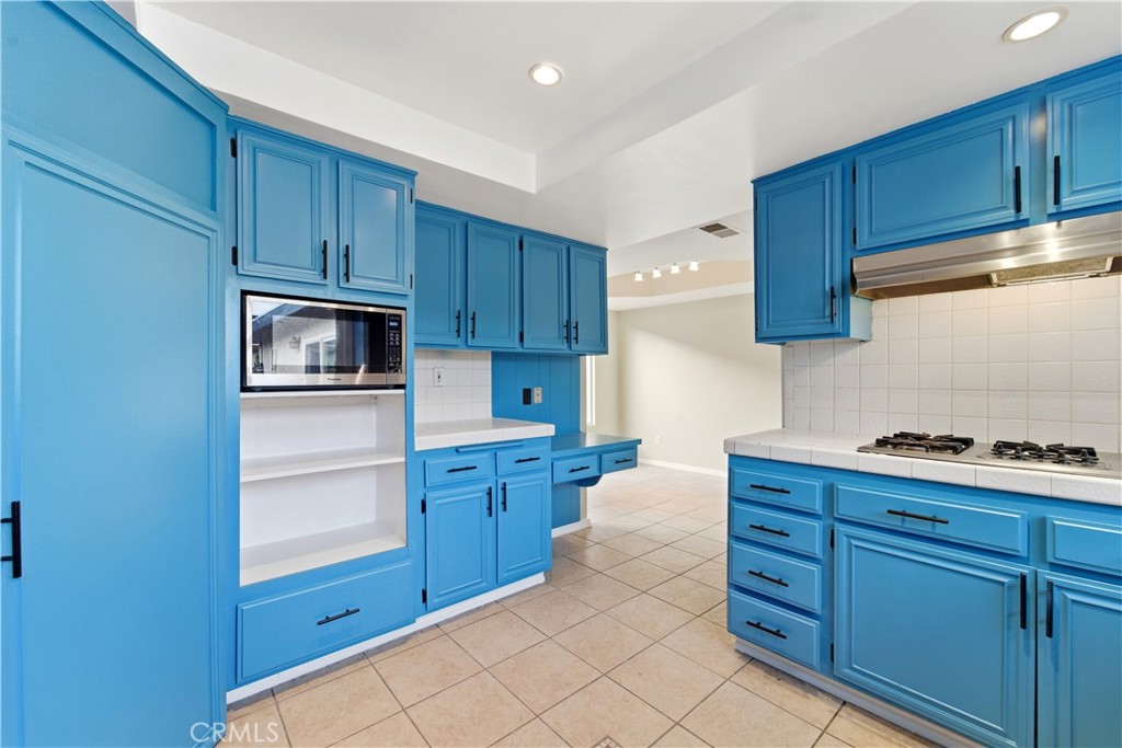 16650 Rinaldi Street Granada Hills, CA 91344 - Photo 15 of 35 a kitchen with cabinets and appliances