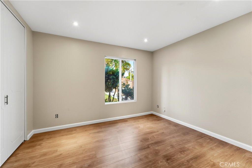 16650 Rinaldi Street Granada Hills, CA 91344 - Photo 20 of 35 an empty room with wooden floor and windows